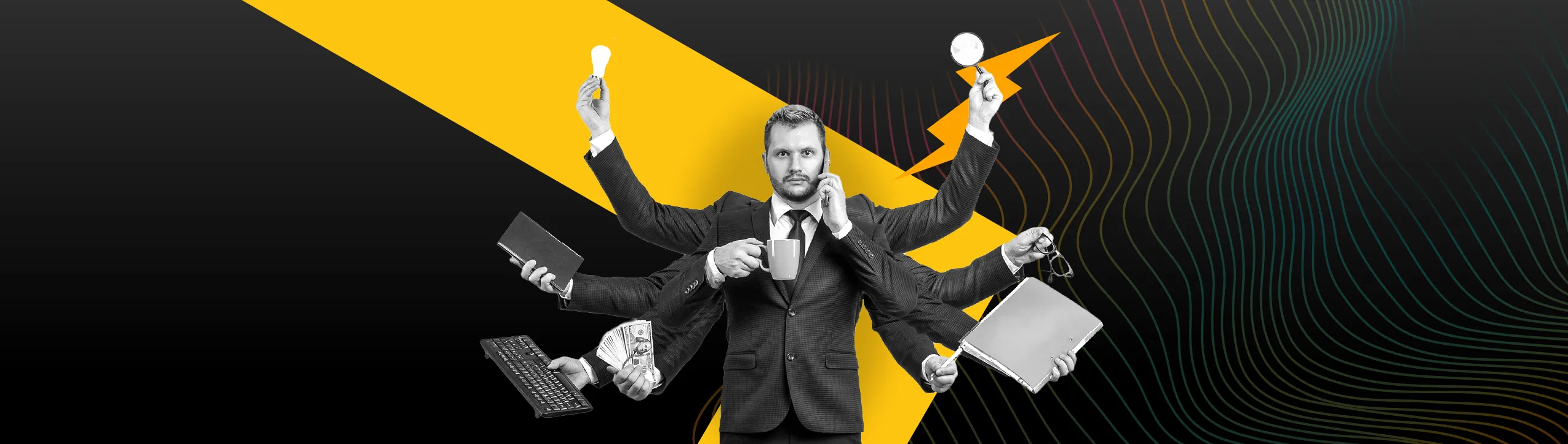 SEO Tools for B2B Companies – man in suit holding many gadgets